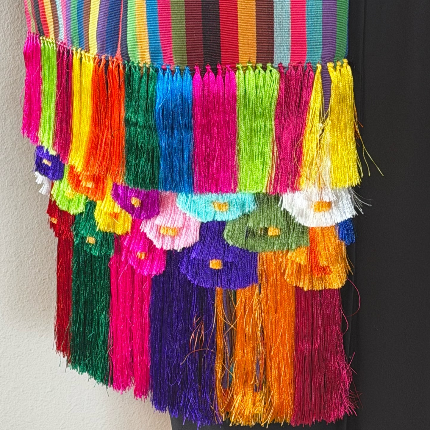 Flat lay of full Purepecha striped rebozo showing 30-inch width and vibrant color stripes