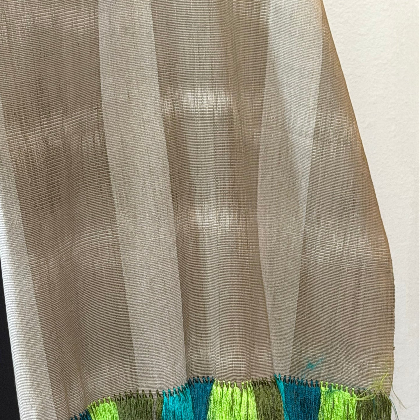 Overhead flat-lay of award-winning Purepecha ikat rebozo showing full color composition and scale