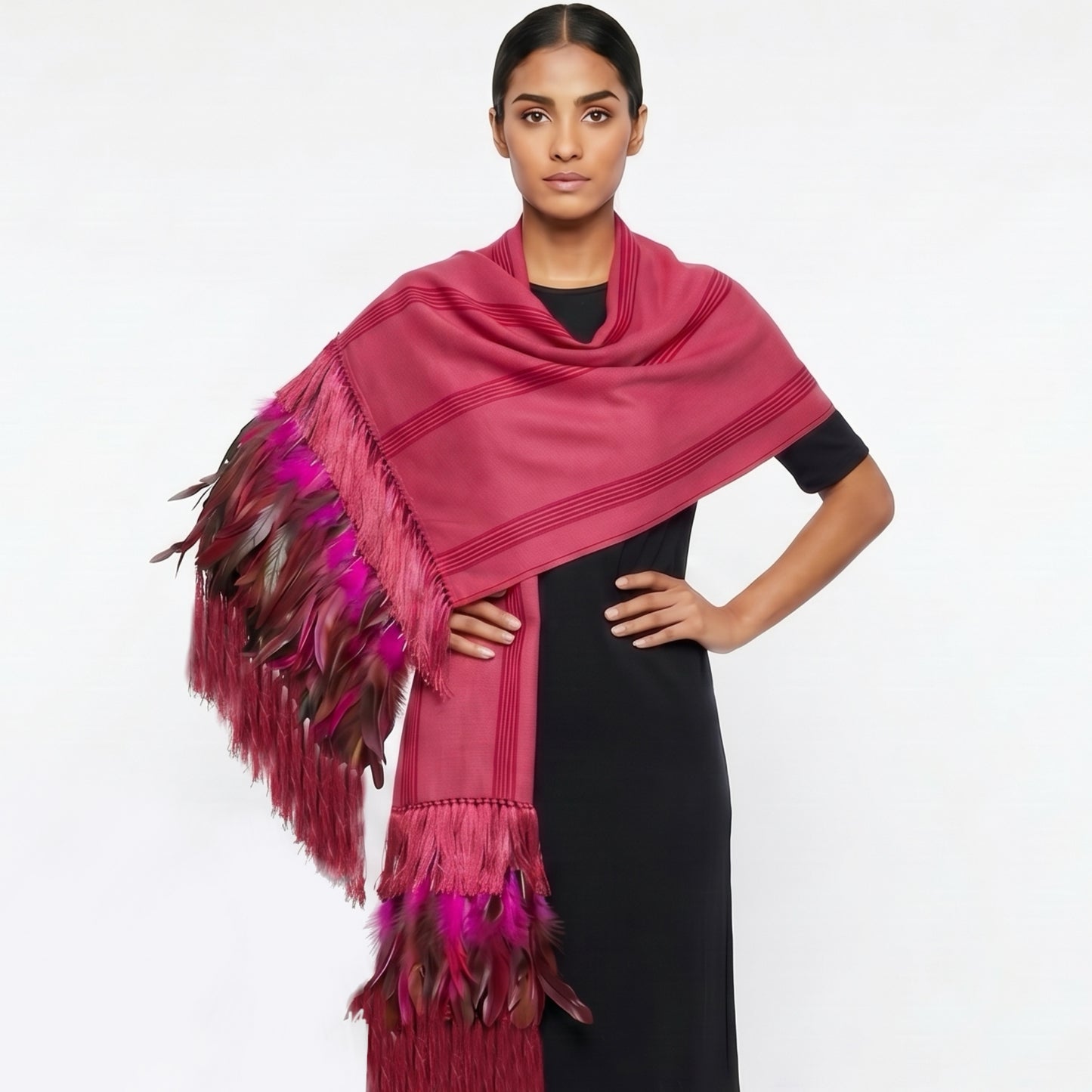 Detail of hand-tied silk flower fringe and woven feather accents on colorful Purepecha cotton rebozo