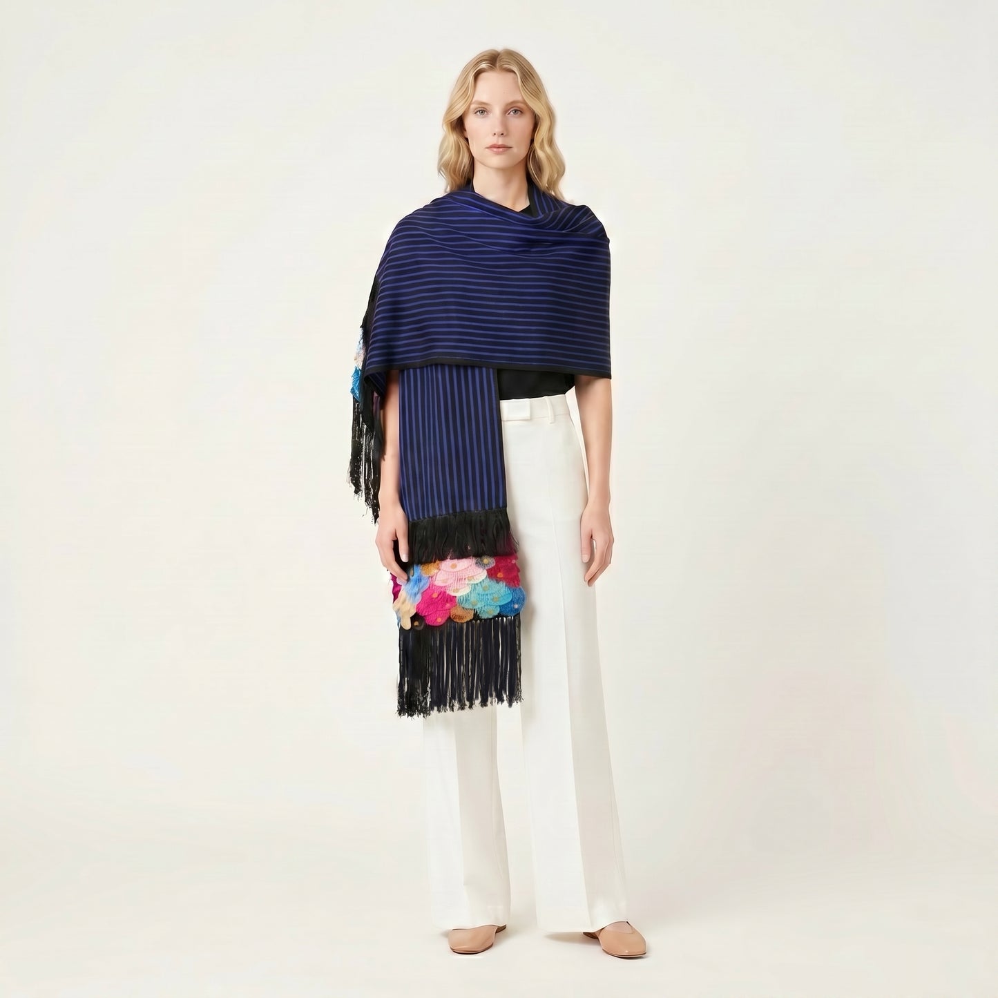 Draped view of blue-stripe Purepecha rebozo showing backstrap-loom weave texture and fringe