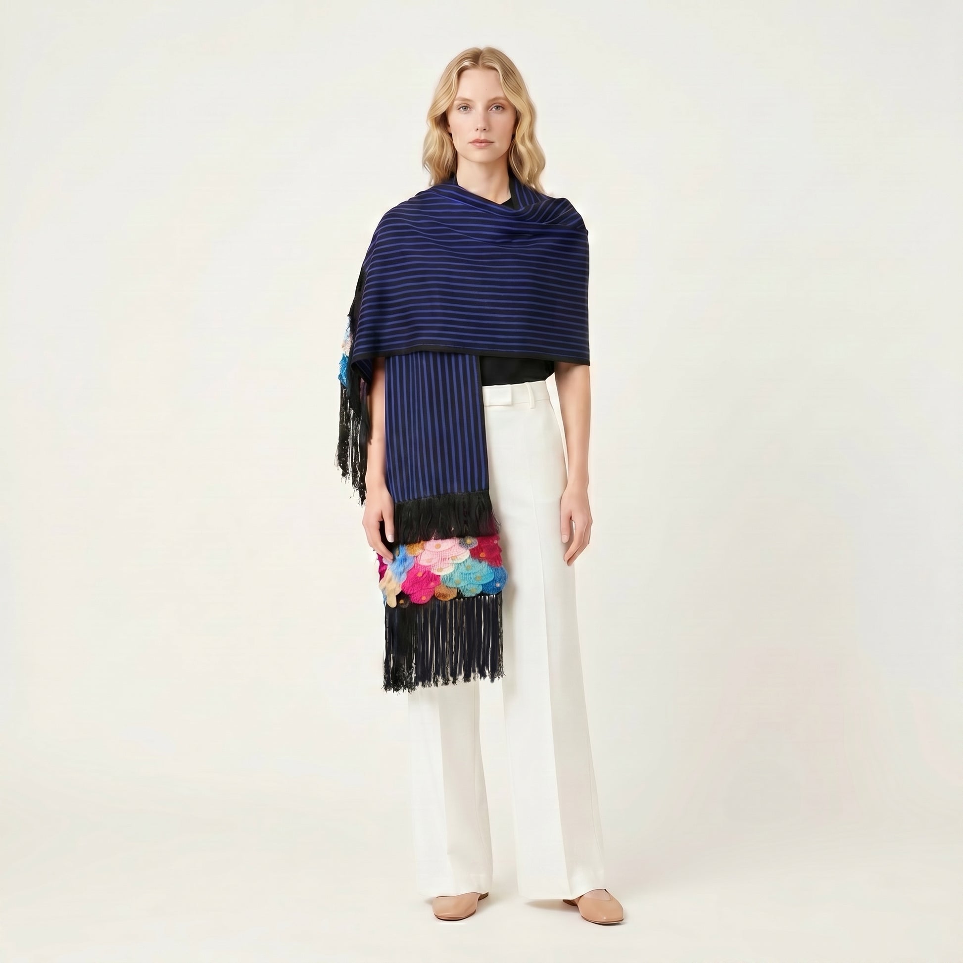 Draped view of blue-stripe Purepecha rebozo showing backstrap-loom weave texture and fringe