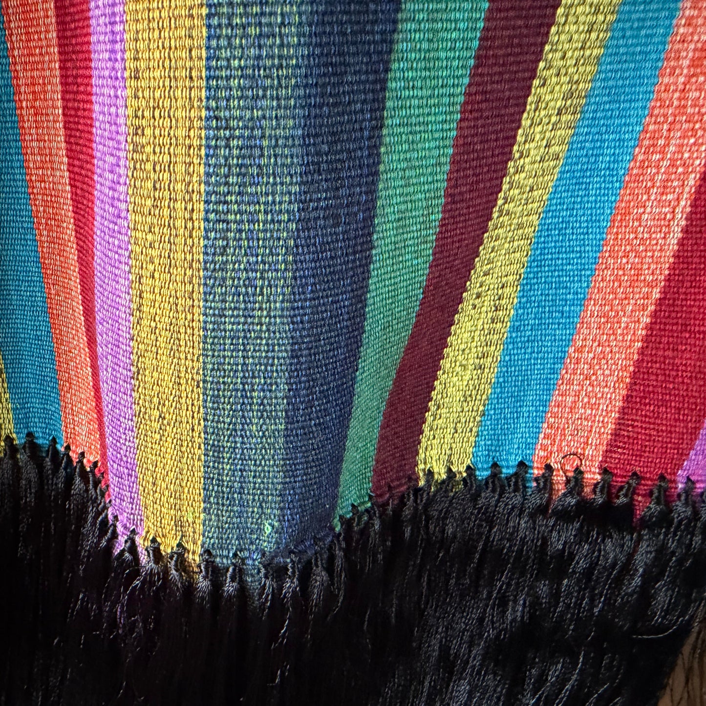 Overhead flat lay of multi-stripe Purepecha rebozo showing full width 30 inches