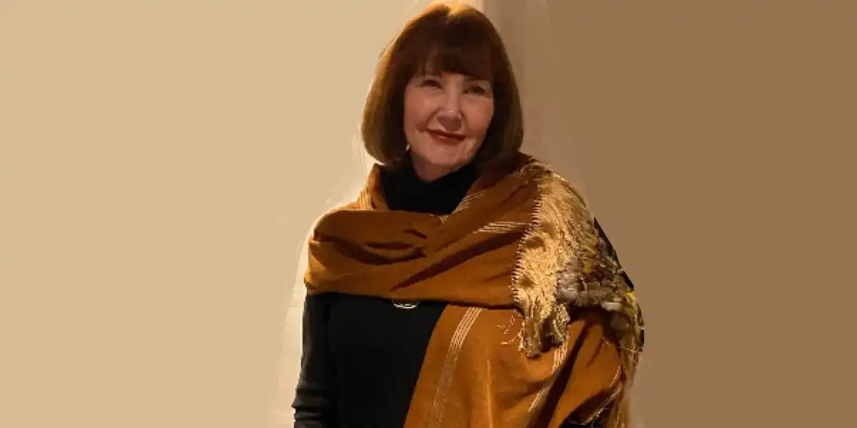 Golden fur-trimmed shawl with black interior and textured pattern