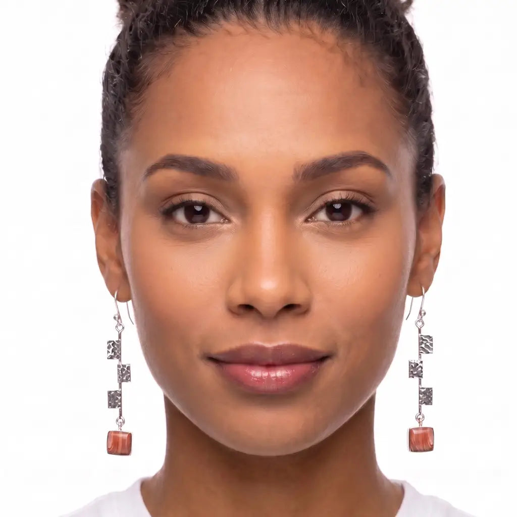 Long silver Taxco dangle earrings with a coral stone