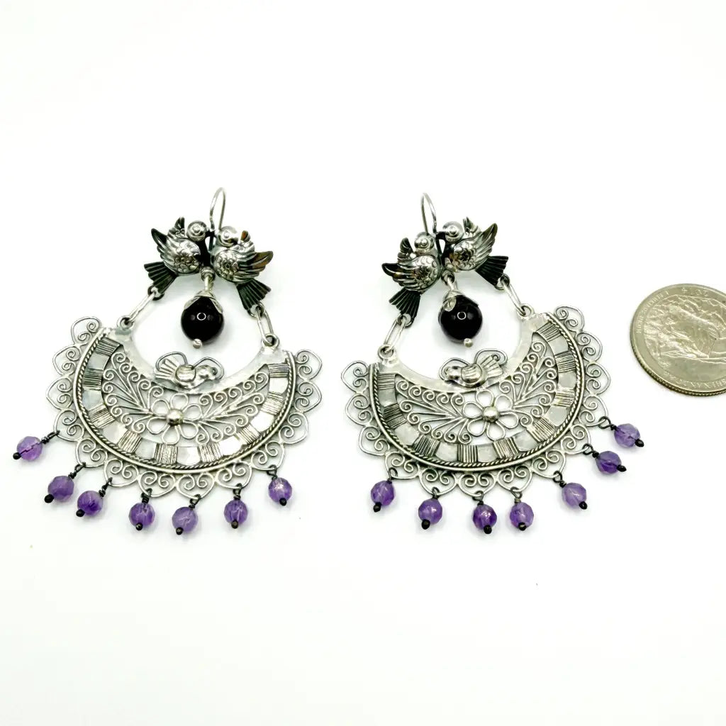 Full pair of Mazahua silver dove earrings with amethyst showing hook back closure and 2-inch width