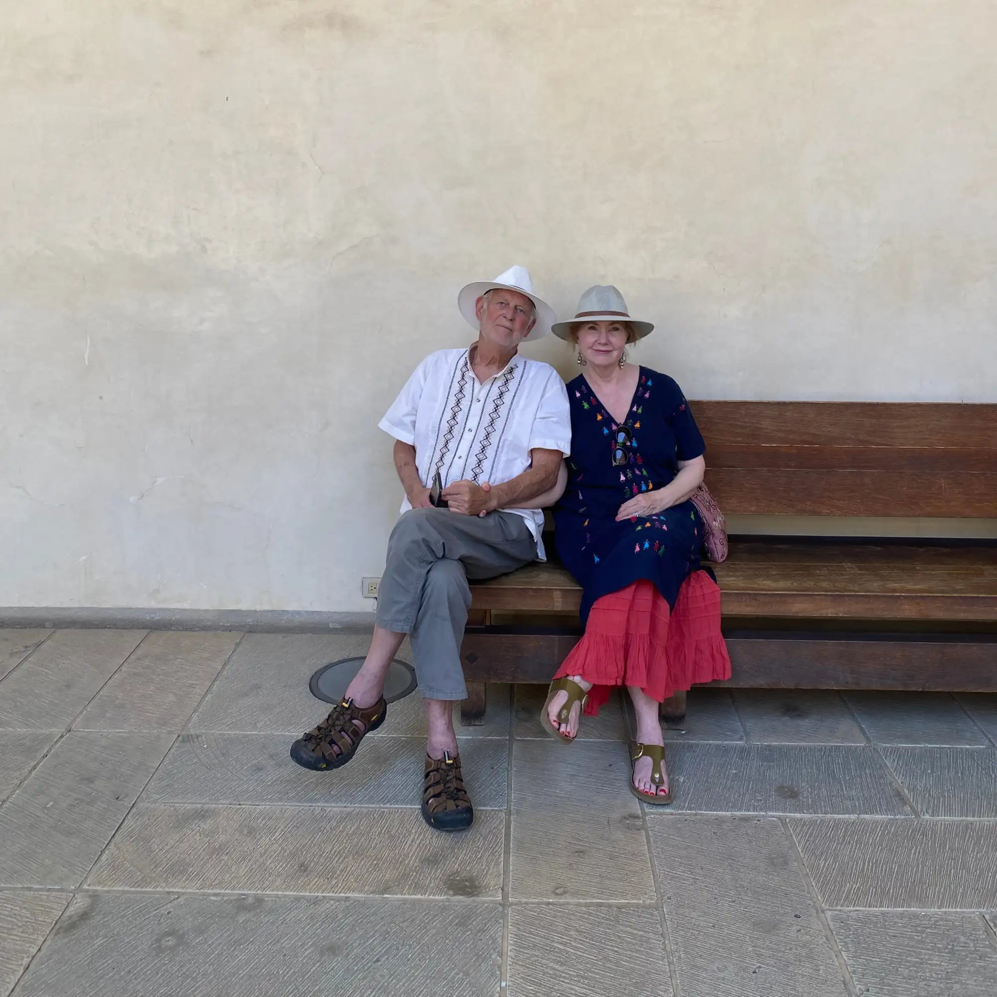 A wooden bench with a natural finish and simple, sturdy construction.